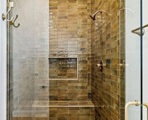 Modern shower with brown tiled walls