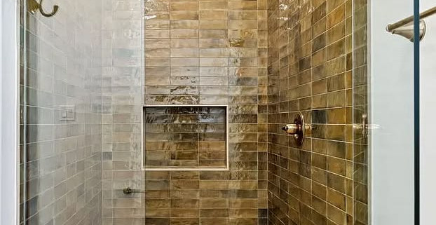 Modern shower with brown tiled walls